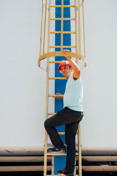 istock Man wearing hard hat, safety goggles 995377826