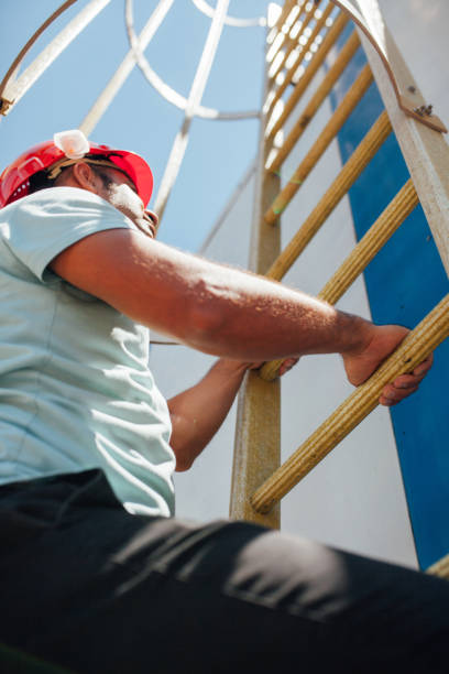istock Man wearing hard hat, safety goggles 995377942