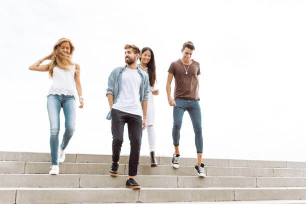 istock friends walking together in barceloneta 995378494