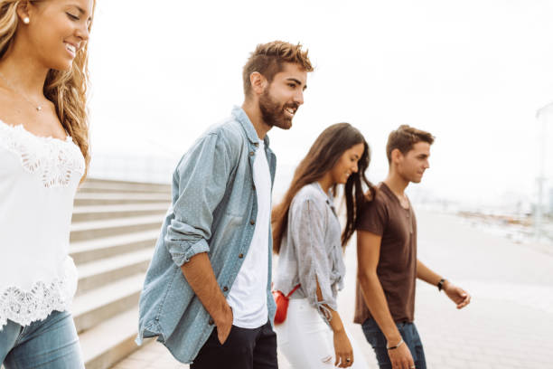 istock friends walking together in barceloneta 995378554