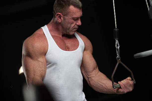 istock Strong mature man working out in the gym 995381442