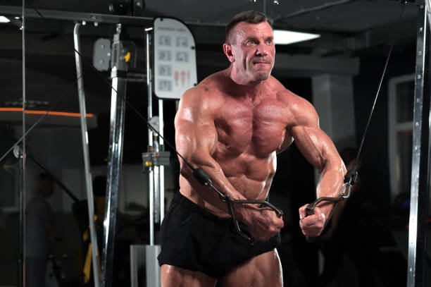 istock Strong mature man working out in the gym 995382286