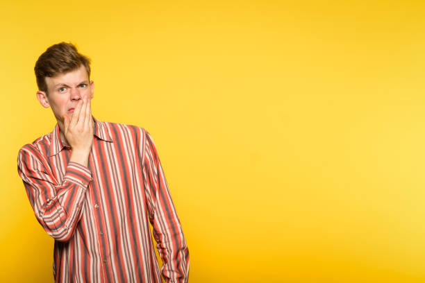 istock squeamishness nausea repulsion man disgusted 995385954