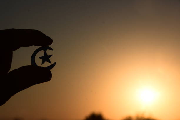 istock A human hand holds A Symbol of Islam 995391998