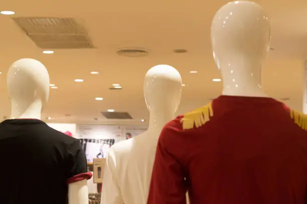 Colorful t-shirts worn by mannequin on sale in departmentstore, colorful t-shirts on event show