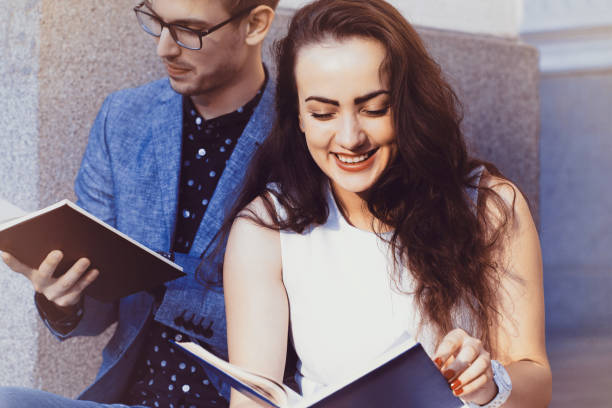 istock Happy couple reading books 995401014