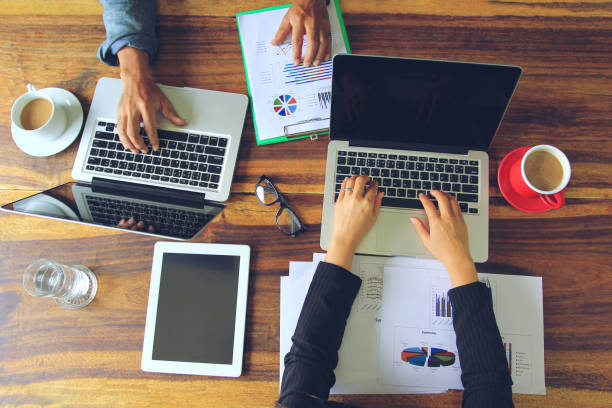 istock Teamwork of two Business people using laptop computer at office, Communication technology and Business concept 995409280