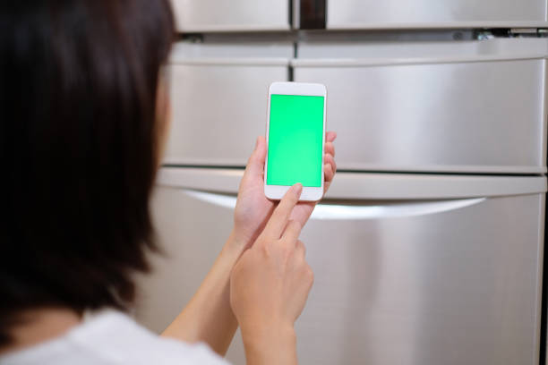 istock green screen of smart phone in front of refrigerator 995419160