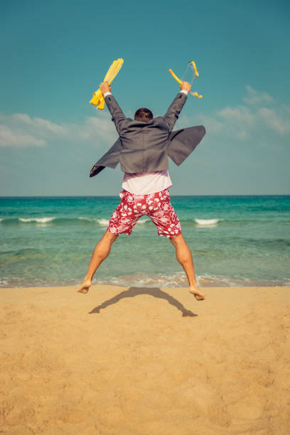 istock Funny businessman on the beach 995419426