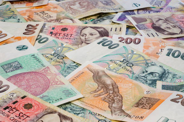 Czech crowns of different denominations spread out chaotically
