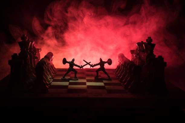 istock Medieval battle scene with cavalry and infantry on chessboard. Chess board game concept of business ideas and competition and strategy ideas Chess figures on a dark background 995434272