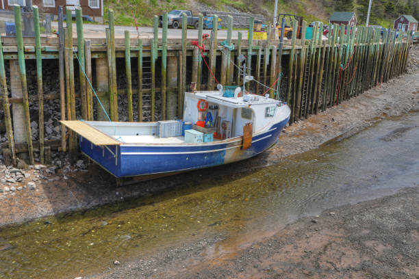 istock View of Halls Harbour, Nova Scotia boat at low tide 995439572