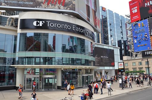 TORONTO, ON / CANADA - MAY 26, 2018: Toronto Eaton Centre, shown here, hosts about fifty million visitors a year.