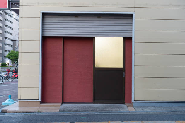 istock sidewalk by street wall & door 995440232