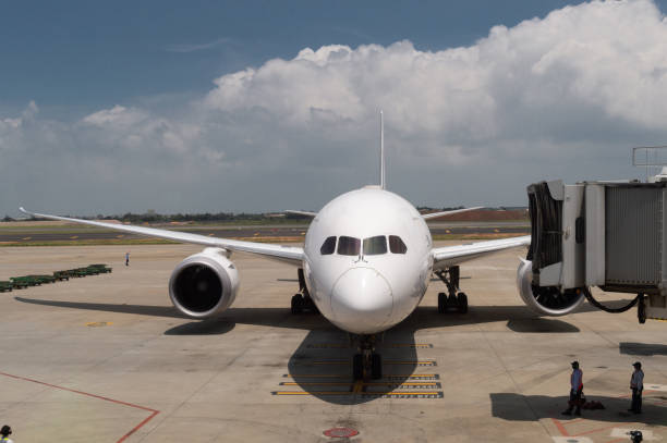 istock Pre-flight and refueling and Loading cargo service of airplane, Airplane's prepare for take-off in gate, terminal international airport. view through window 995448800