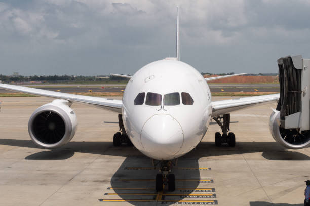 istock Pre-flight and refueling and Loading cargo service of airplane, Airplane's prepare for take-off in gate, terminal international airport. view through window 995454600
