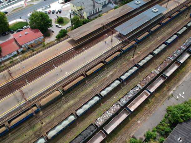 istock Cargo wagons on train station in city, aerial view 995458482