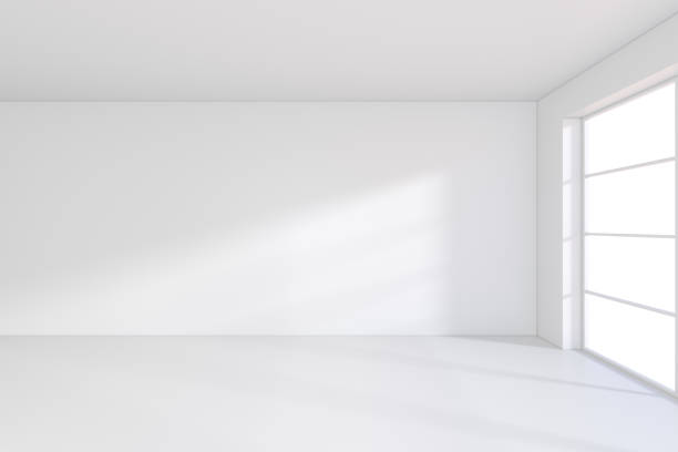istock large office with windows and falling light from the window to the floor. 3D rendering 995458768