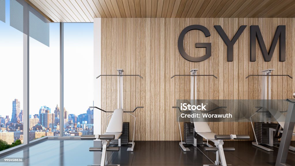 Gym equipments are placed in fitness center , 3d rendering Gym machine for fitness center with city view Gym Stock Photo