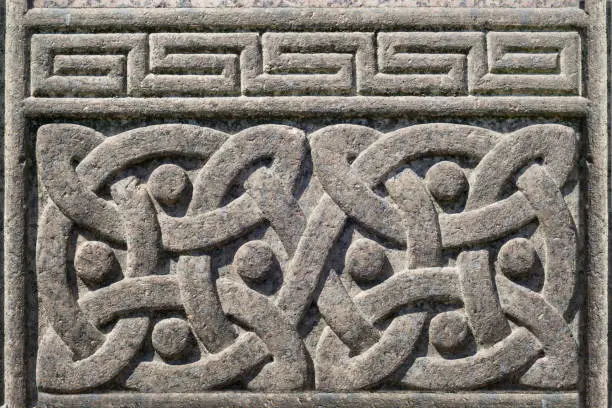 Photo of Old stone carved Celtic design symbol, Celtic knot