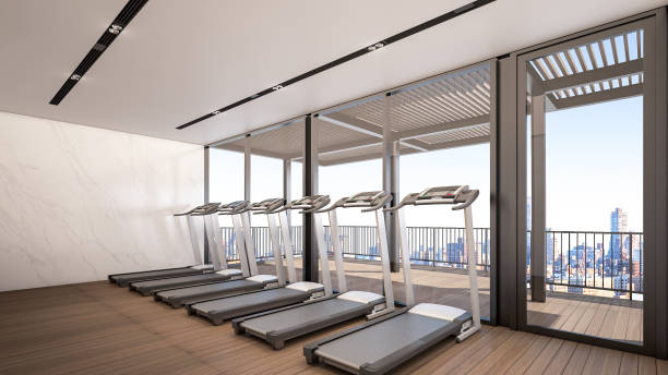 istock Gym at high rise condominium with Sky City view , 3d rendering 995458886