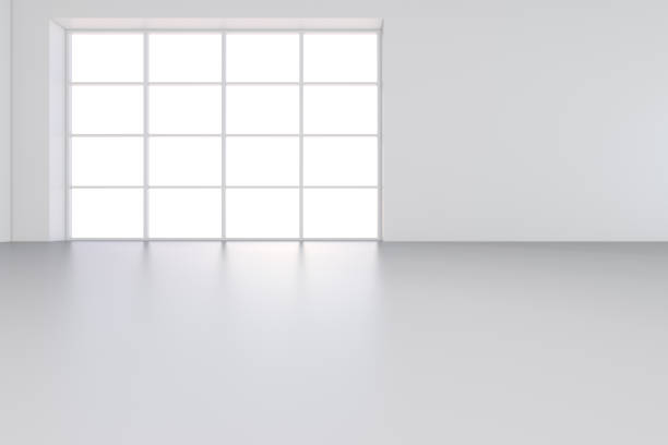 istock Large room with windows and falling light from the window on the wall. 3D rendering 995458908