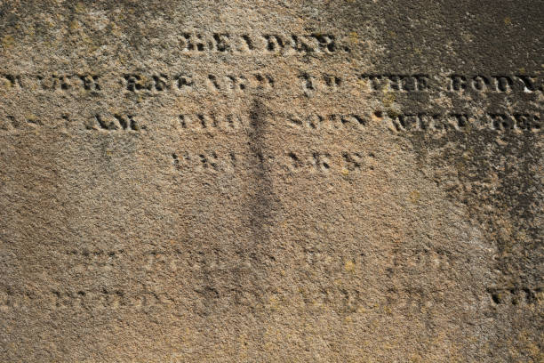 istock Worn our stone surface with partly readable engraved Latin letters 995469008