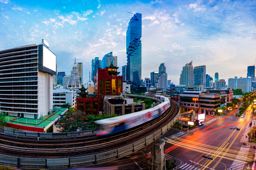 Aerial view of Bangkok modern office buildings and condominium in Bangkok city downtown with blue sky and clouds at Bangkok, Thailand. BTS skytrain
