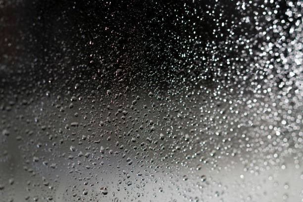 istock water drop on glass when raining for bakcground. 995481606