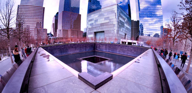 9-11 Memorial Fisheye view of the 9-11 Memorial at the site where the twin towers of the World Trade Center once stood. to the struggle against world terrorism statue photos stock pictures, royalty-free photos & images