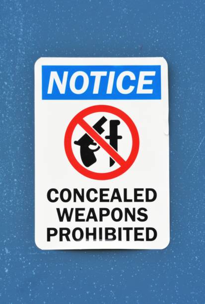 No Weapons Sign Presumed deterrent for armed criminals. gun free zone sign stock pictures, royalty-free photos & images