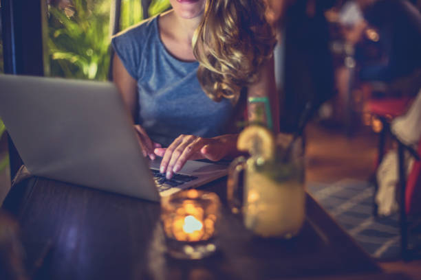 istock Young woman working in night bar 995502422