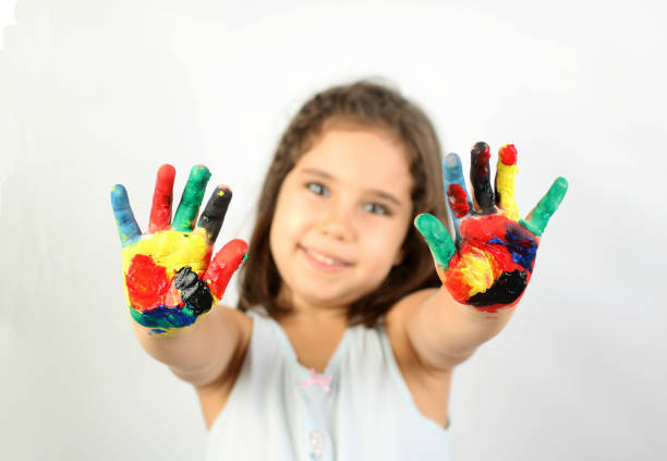 istock Cute girl with painted hands 995504206