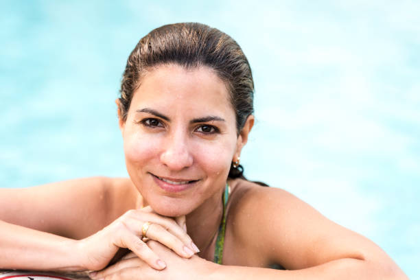 istock Smiling mature woman at the pool 995518260