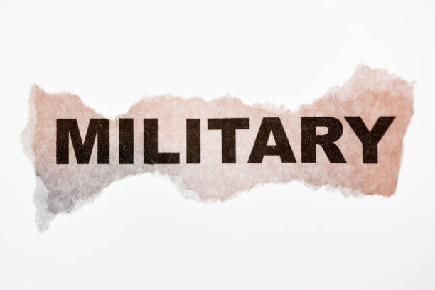 istock Military word on old torn paper isolated on white. 995519482