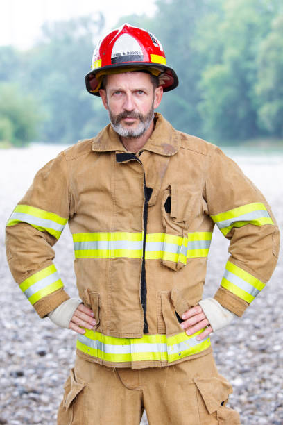 istock portrait of handsome fireman in uniform 995524028