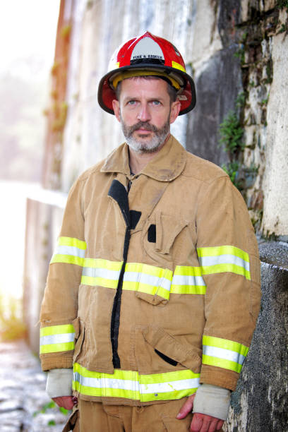 istock portrait of handsome fireman in uniform 995524226