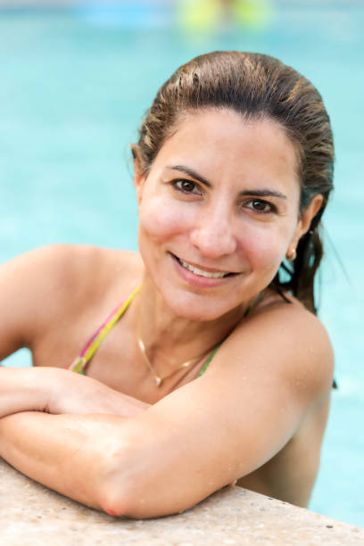 istock Smiling mature woman at the pool 995524982