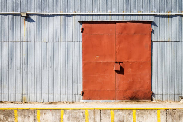 istock Old metal warehouse door, hangar gate 995533776