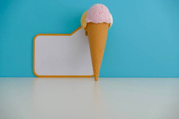 istock Icecream cone and a spreech bubble on blue background 995535904