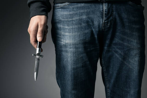 Man and knife Man and knife switchblade stock pictures, royalty-free photos & images