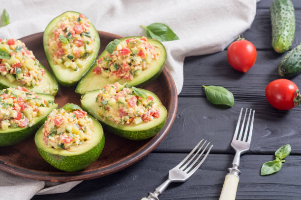 istock Avocado stuffed with cucumber , tomatoes and eggs 995539280