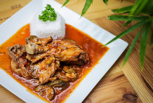 basquaise Basque style spicy chicken and vegetable casserole stew meal on wooden table