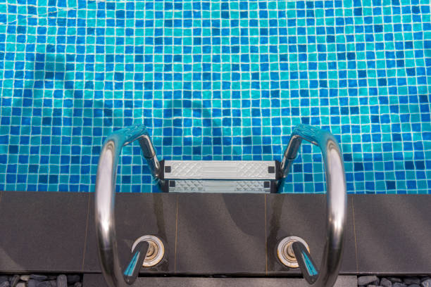 istock Beautiful luxury swimming pool with Pool stair on sunny day 995556464