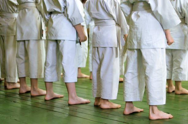 istock Kids of karate. Training and exam in karate. 995580110