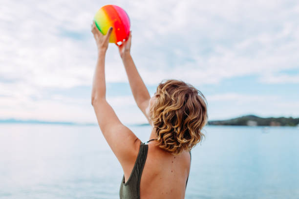 istock young woman having fun on the beach 995594800