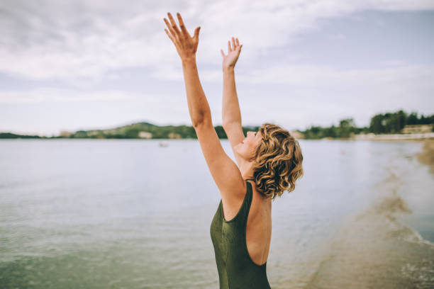 istock young woman having fun on the beach 995595020