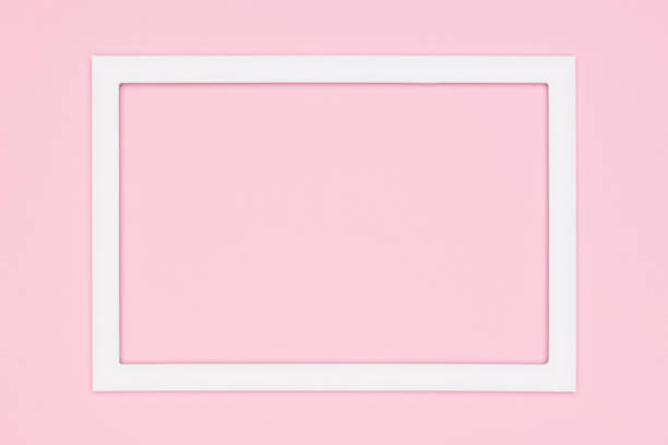 istock Abstract flat lay pastel pink colored paper texture minimalism background. Minimal template with empty picture frame mock up. 995596330
