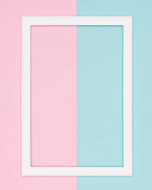 istock Abstract geometrical pastel blue and pink colored paper flat lay background. Minimalism template with empty picture frame mock up. 995600480