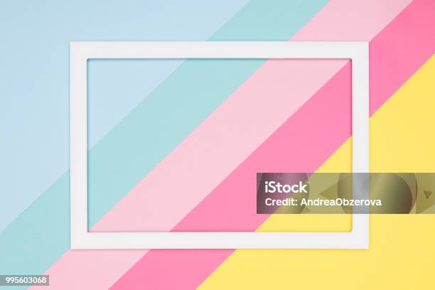 Abstract Geometrical Pastel Blue Pink And Yellow Paper Flat Lay Background Minimalism Geometry And Symmetry Template With Empty Picture Frame Mock Up Stock Photo - Download Image Now